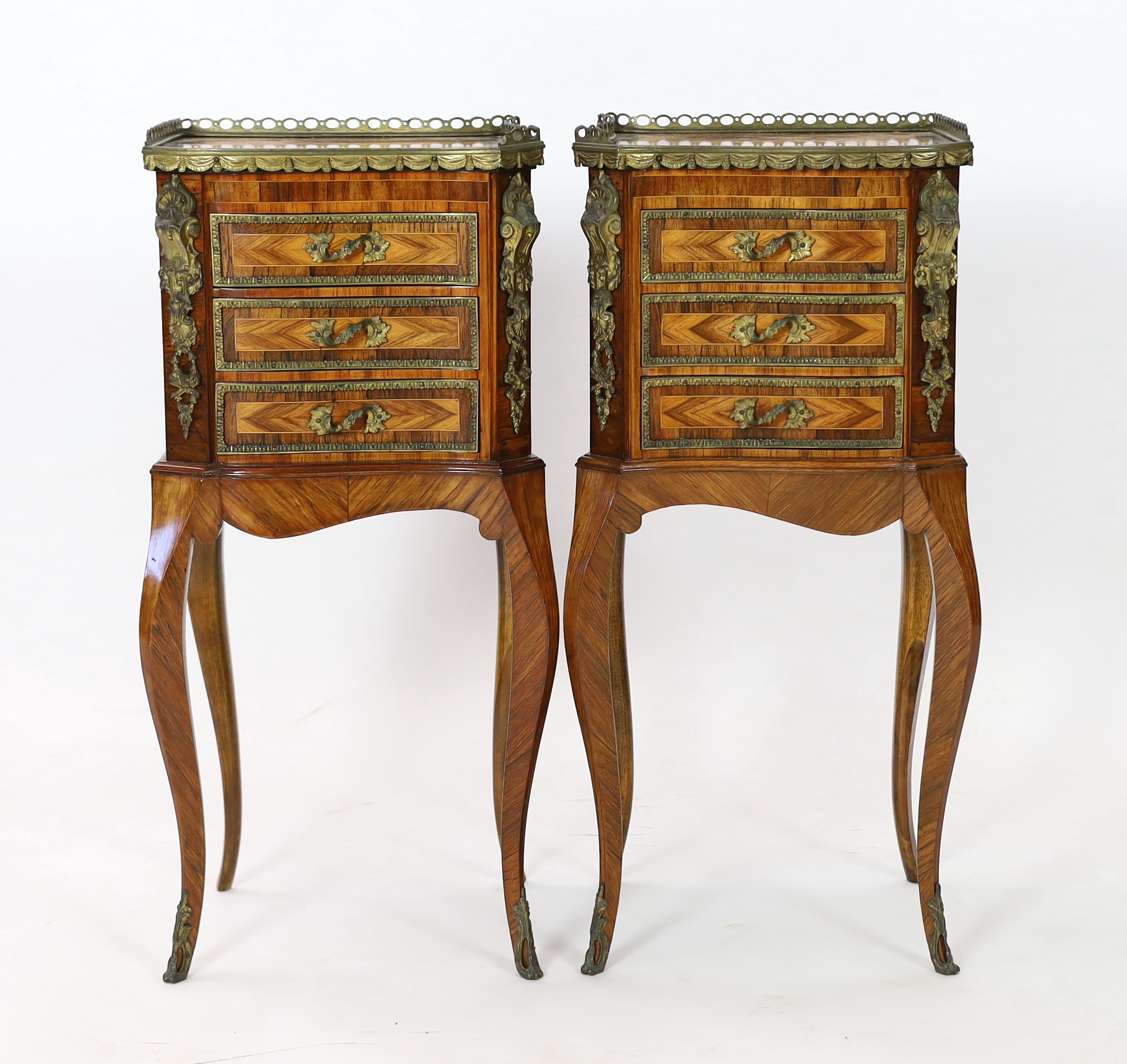 A pair of Louis XVI style ormolu mounted kingwood bedside chests, 34cm wide, 27cm deep, 74cm high